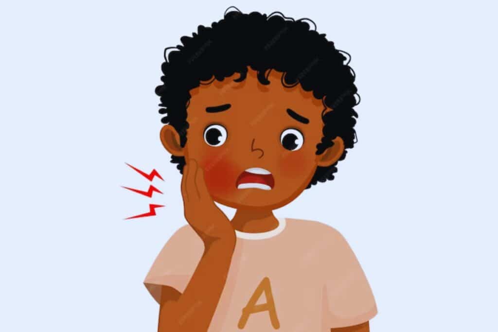A boy suffering from toothache touching his cheek | Jupiter Dentist